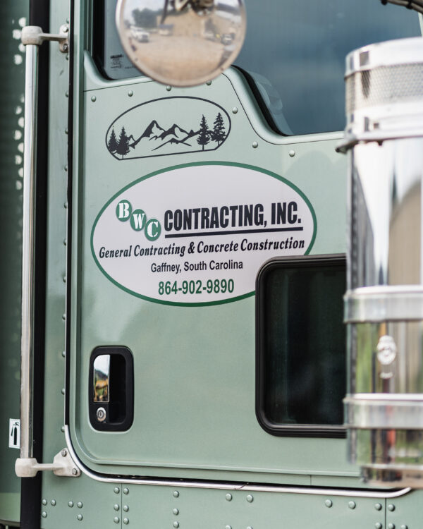 BWC Contracting, Inc. logo on a truck door, highlighting general contracting and concrete construction services in Gaffney, South Carolina.